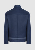 Blouson zippé en laine bleu à découpes contrastées