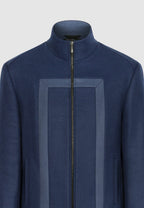Blouson zippé en laine bleu à découpes contrastées